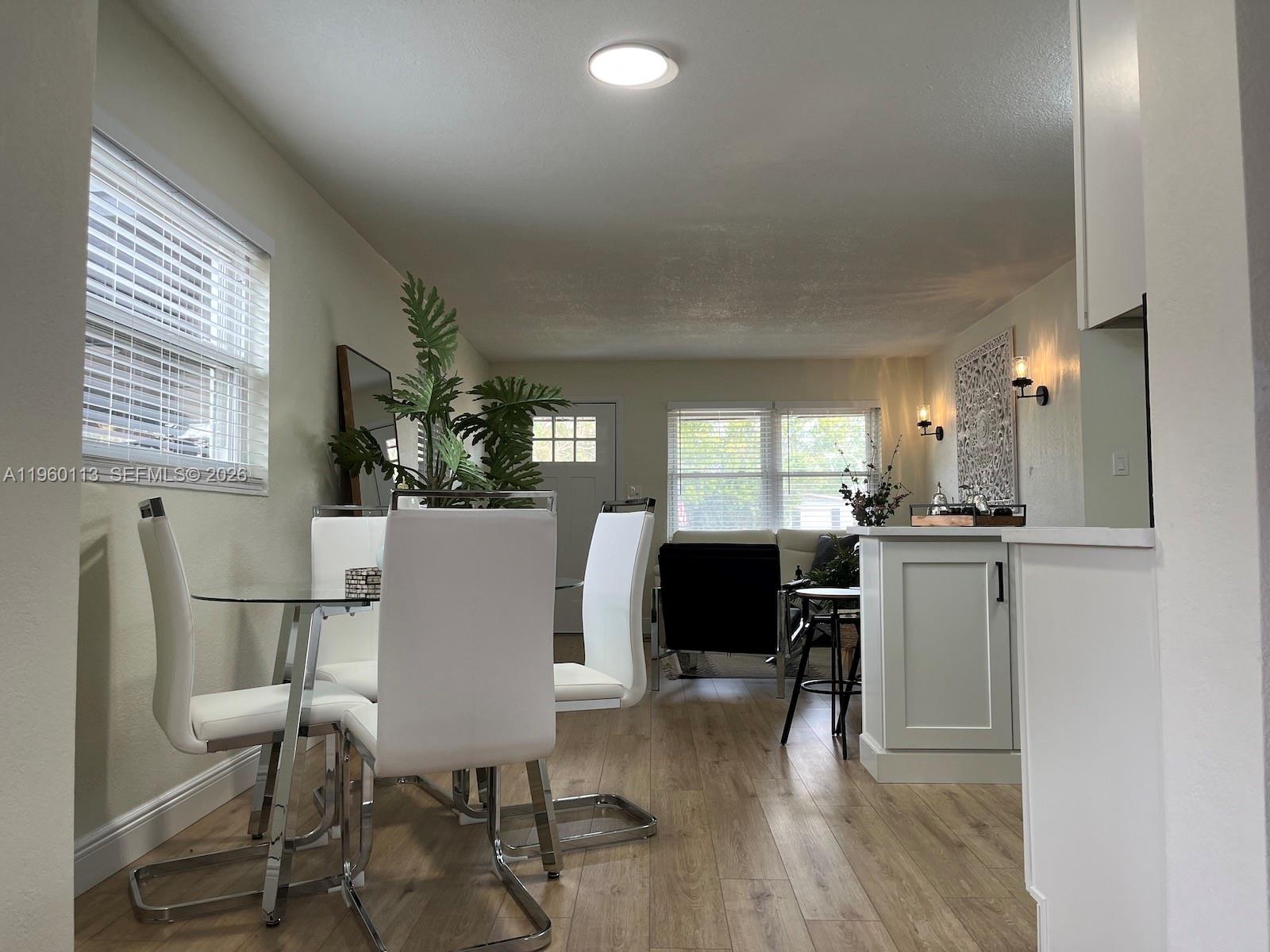 2253 Dordon Drive Melbourne, FL 32935 - Photo 24 of 40 a view of a dining room with furniture and a window