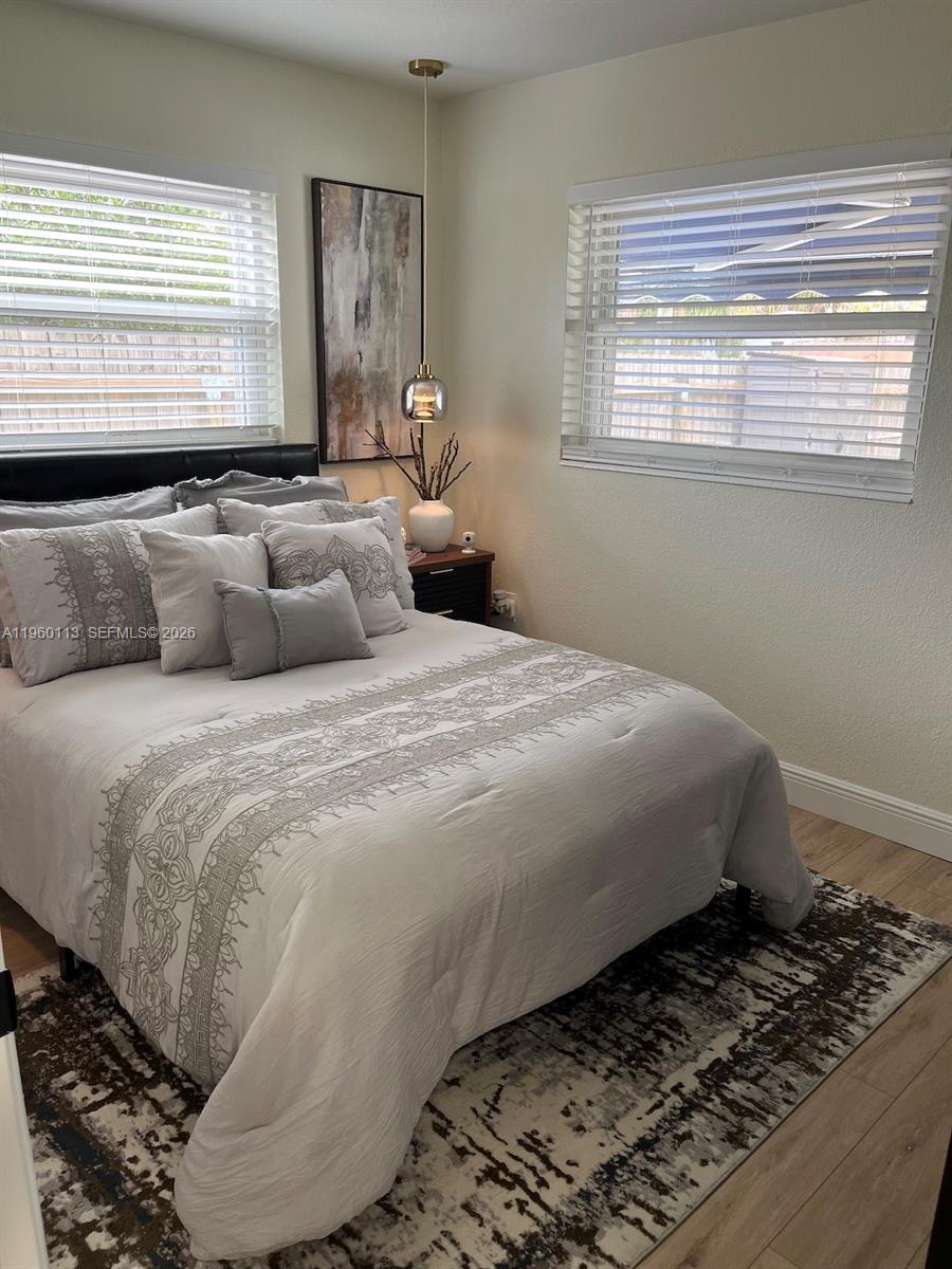 2253 Dordon Drive Melbourne, FL 32935 - Photo 26 of 40 a bedroom with a bed and a window