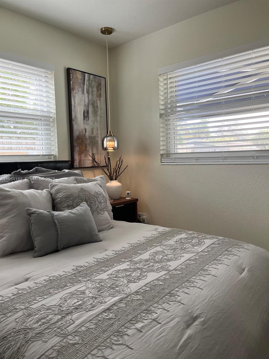 2253 Dordon Drive Melbourne, FL 32935 - Photo 27 of 40 a bedroom with a bed and window