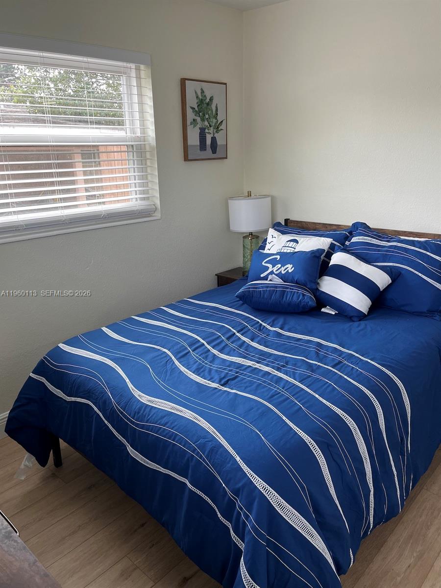 2253 Dordon Drive Melbourne, FL 32935 - Photo 29 of 40 a bedroom with a bed and window