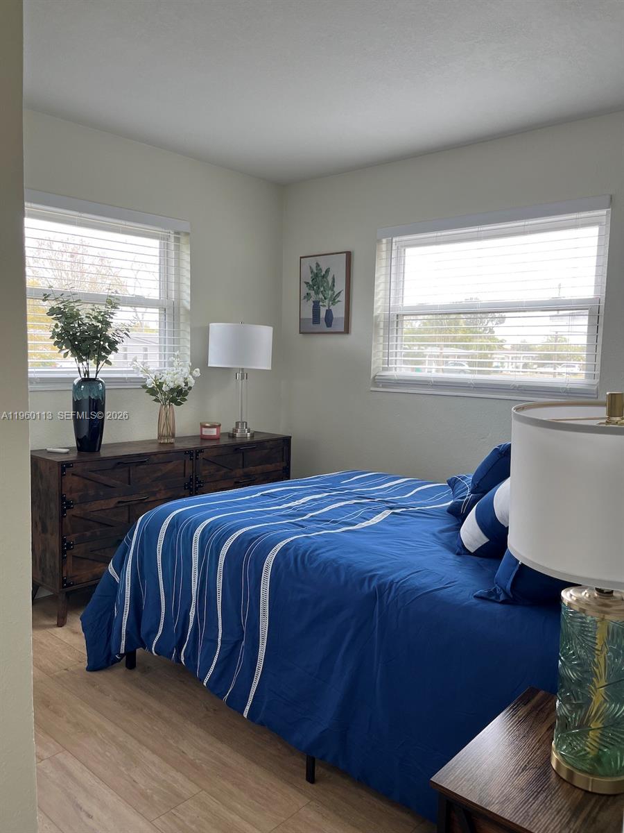 2253 Dordon Drive Melbourne, FL 32935 - Photo 30 of 40 a bedroom with a bed and window