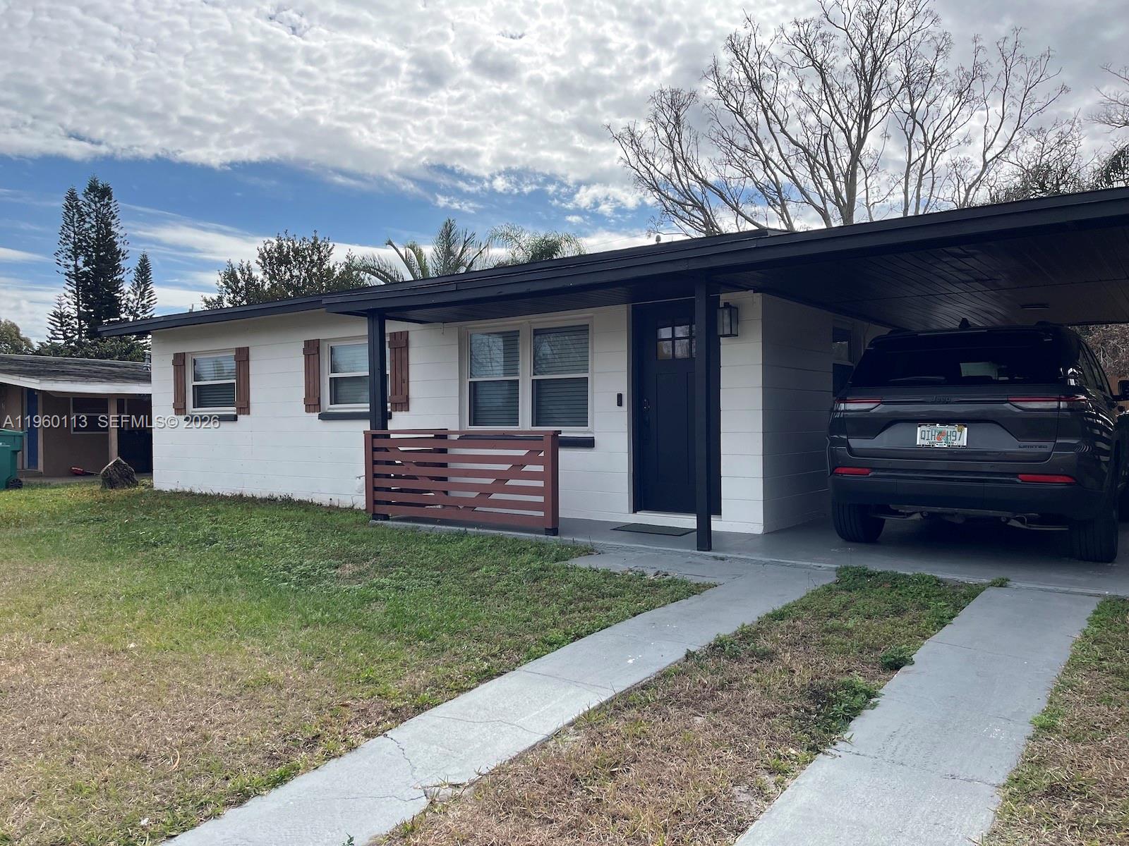 2253 Dordon Drive Melbourne, FL 32935 - Photo 3 of 40 a view of a house with a backyard and a patio