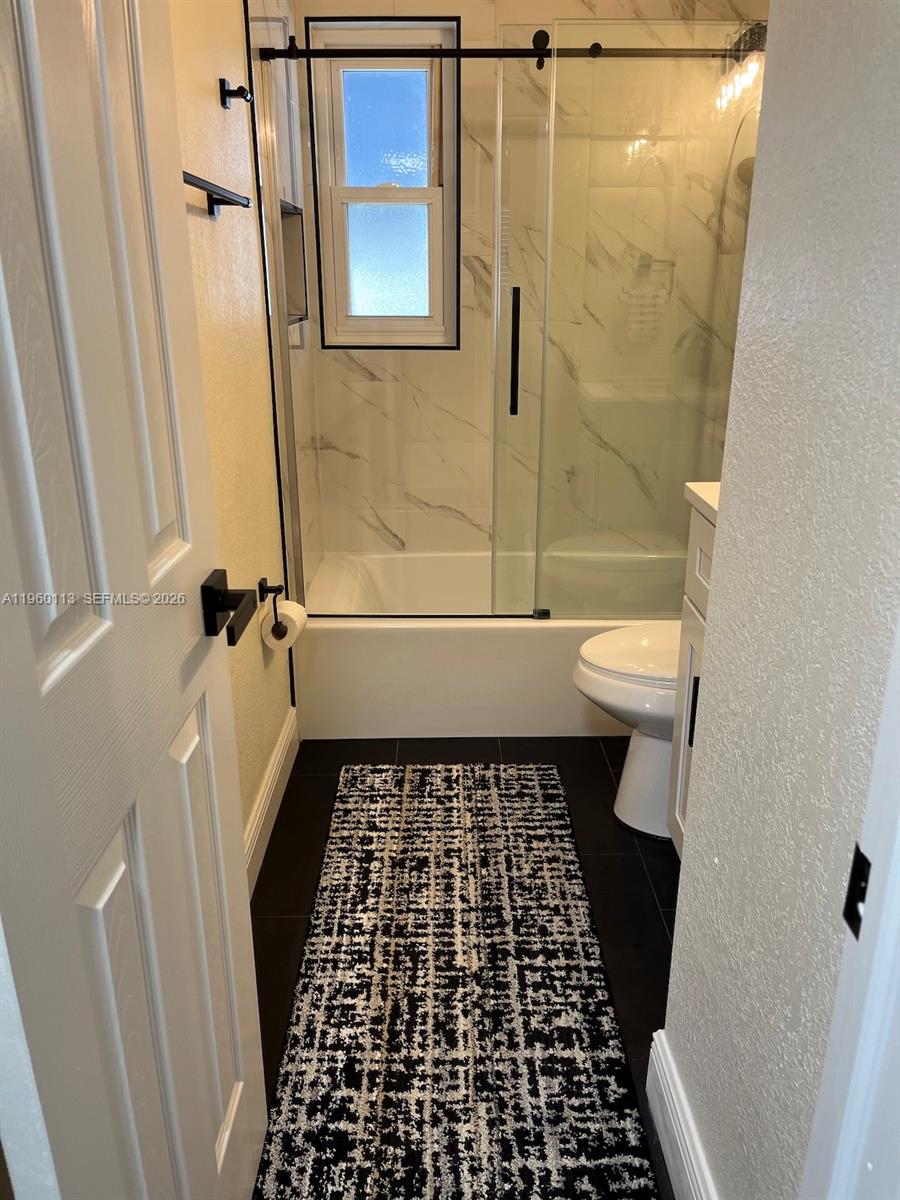 2253 Dordon Drive Melbourne, FL 32935 - Photo 31 of 40 a bathroom with a sink a toilet and a shower