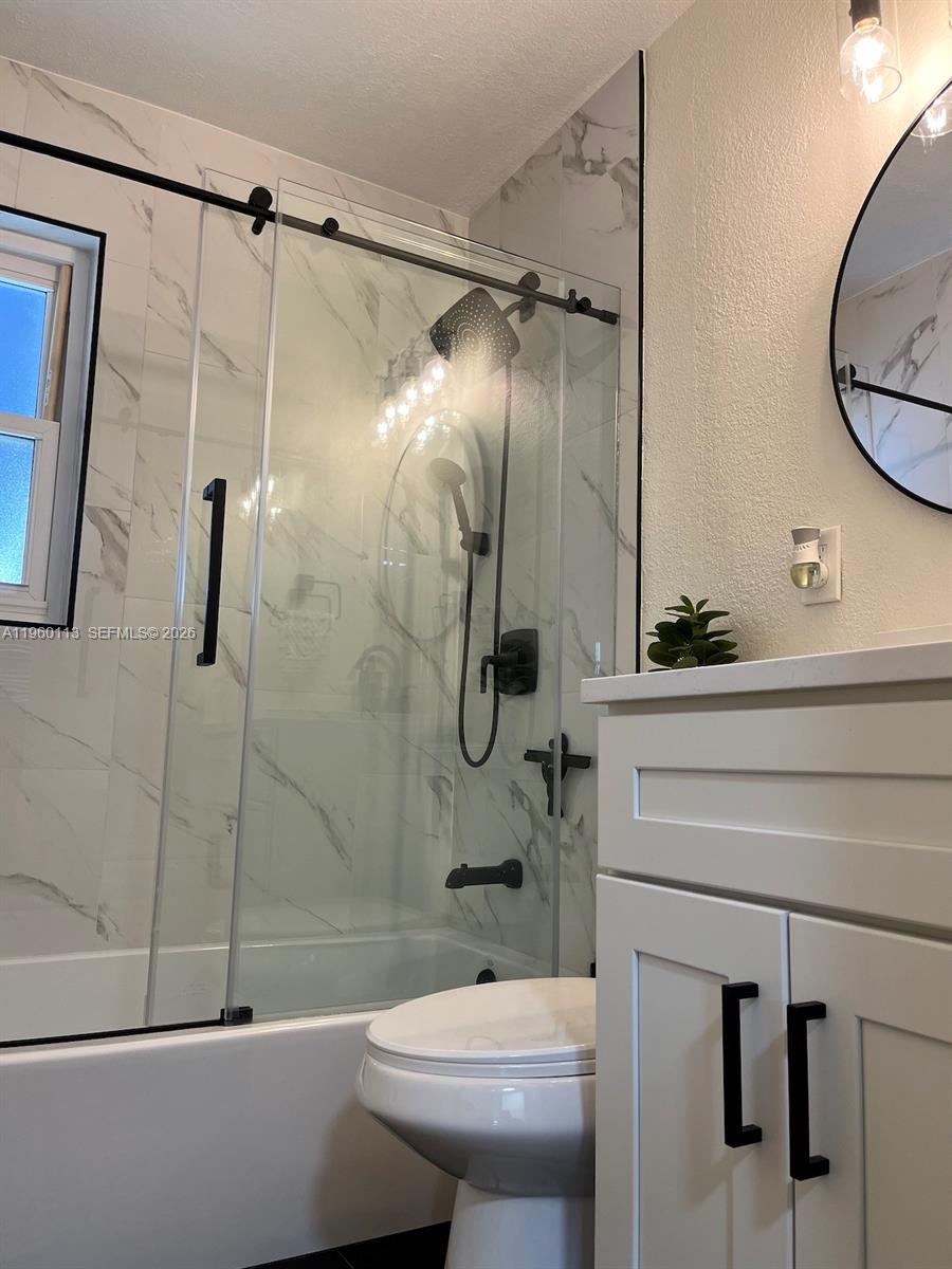 2253 Dordon Drive Melbourne, FL 32935 - Photo 33 of 40 a bathroom with a sink a toilet and shower