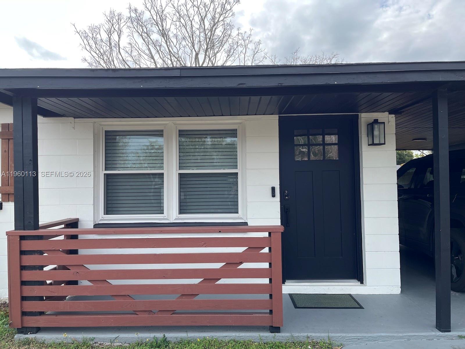 2253 Dordon Drive Melbourne, FL 32935 - Photo 5 of 40 a front view of a house with a porch