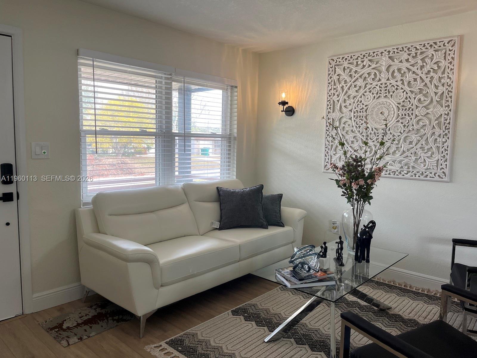2253 Dordon Drive Melbourne, FL 32935 - Photo 7 of 40 a living room with furniture and a potted plant