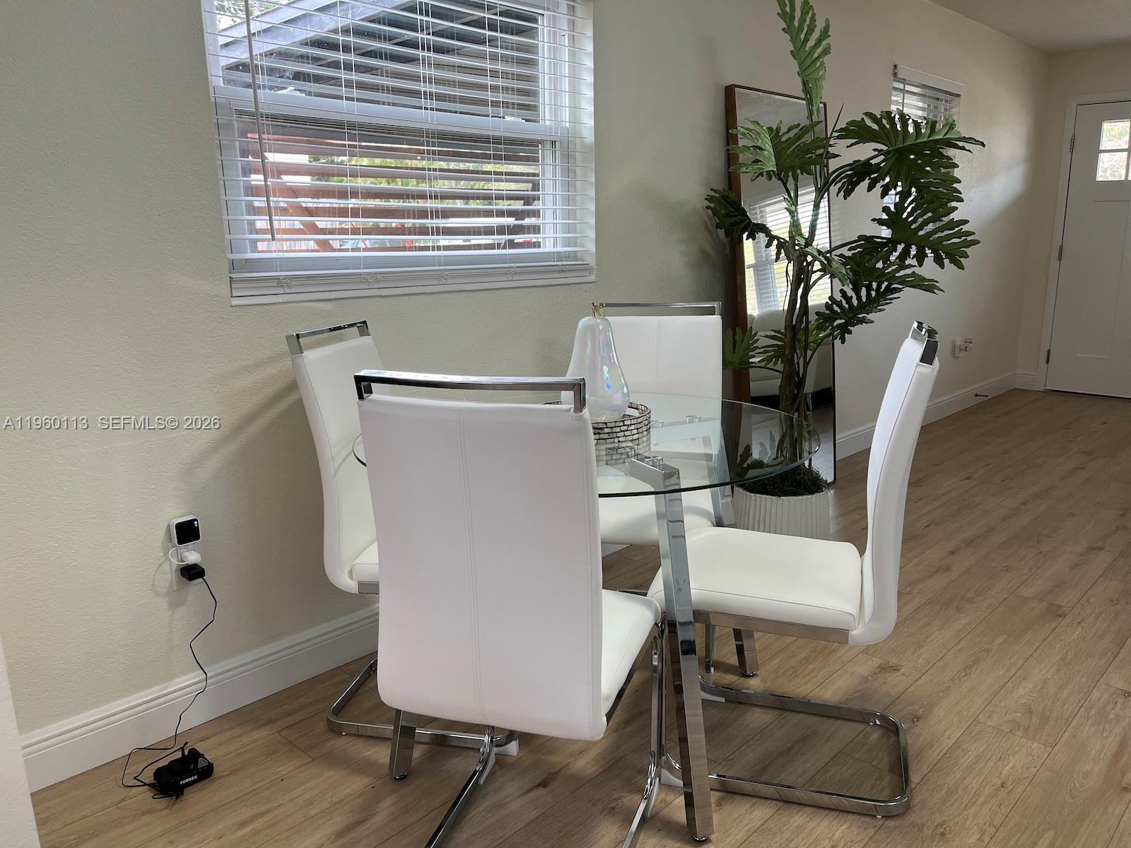 2253 Dordon Drive Melbourne, FL 32935 - Photo 10 of 40 a living room with furniture and a potted plant