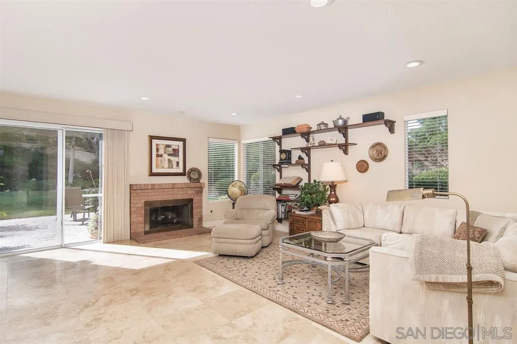13861 Carriage Road Poway, CA 92064 - Photo 10 of 25 a living room with furniture and a fireplace