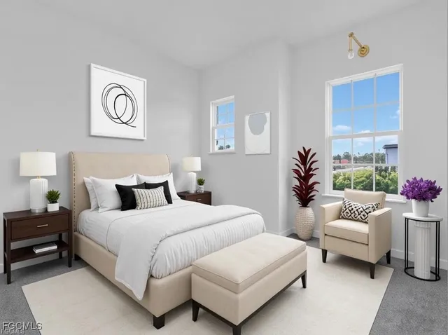 a bedroom with a bed and a couch