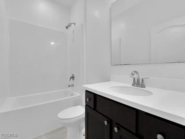 a bathroom with a sink a toilet and a bathtub