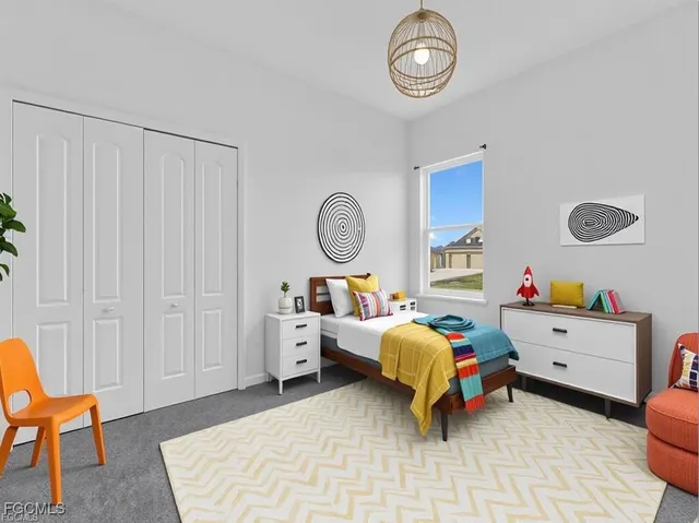 a bed room with furniture and a chandelier