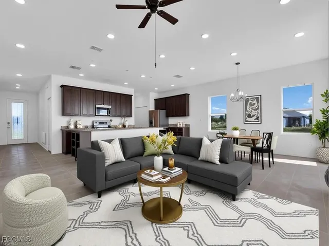 a living room with furniture and kitchen view