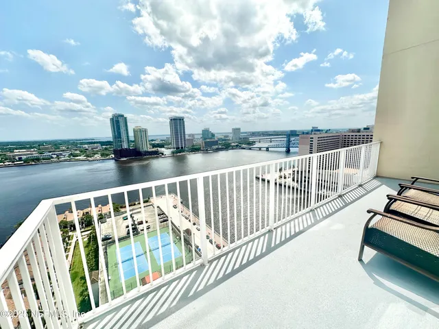 a view of balcony with furniture