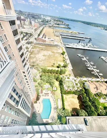 a view of swimming pool with outdoor seating and wooden floor