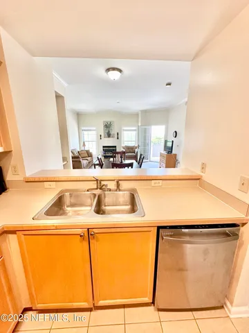 a room with sink and mirror
