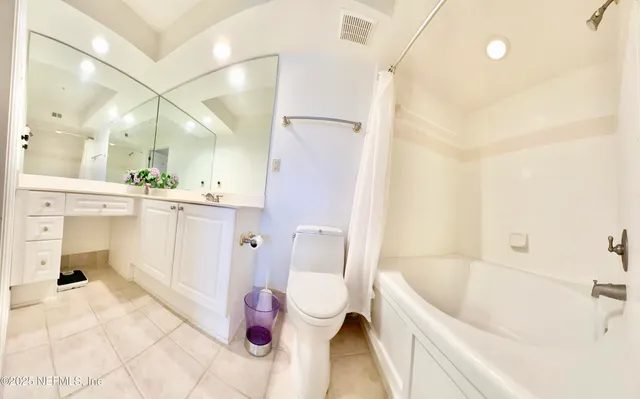 a bathroom with a bathtub sink and toilet