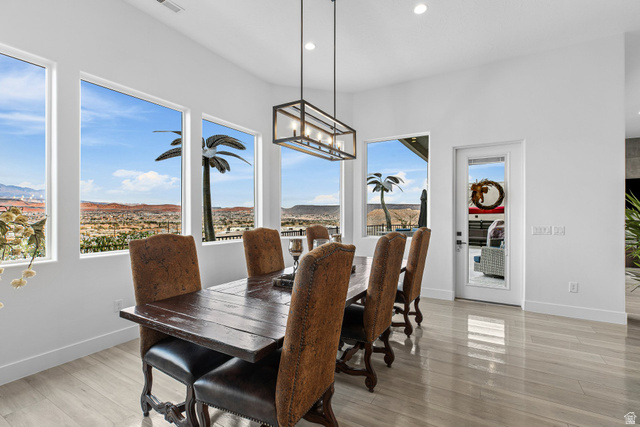 3022 West Sesia Way St. George, UT 84770 - Photo 52 of 52 Dining space featuring light wood finished floors and suspended lighting