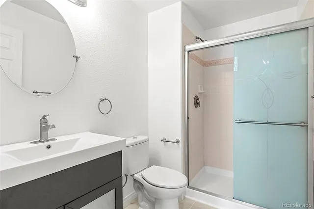 a bathroom with a sink a mirror and a toilet