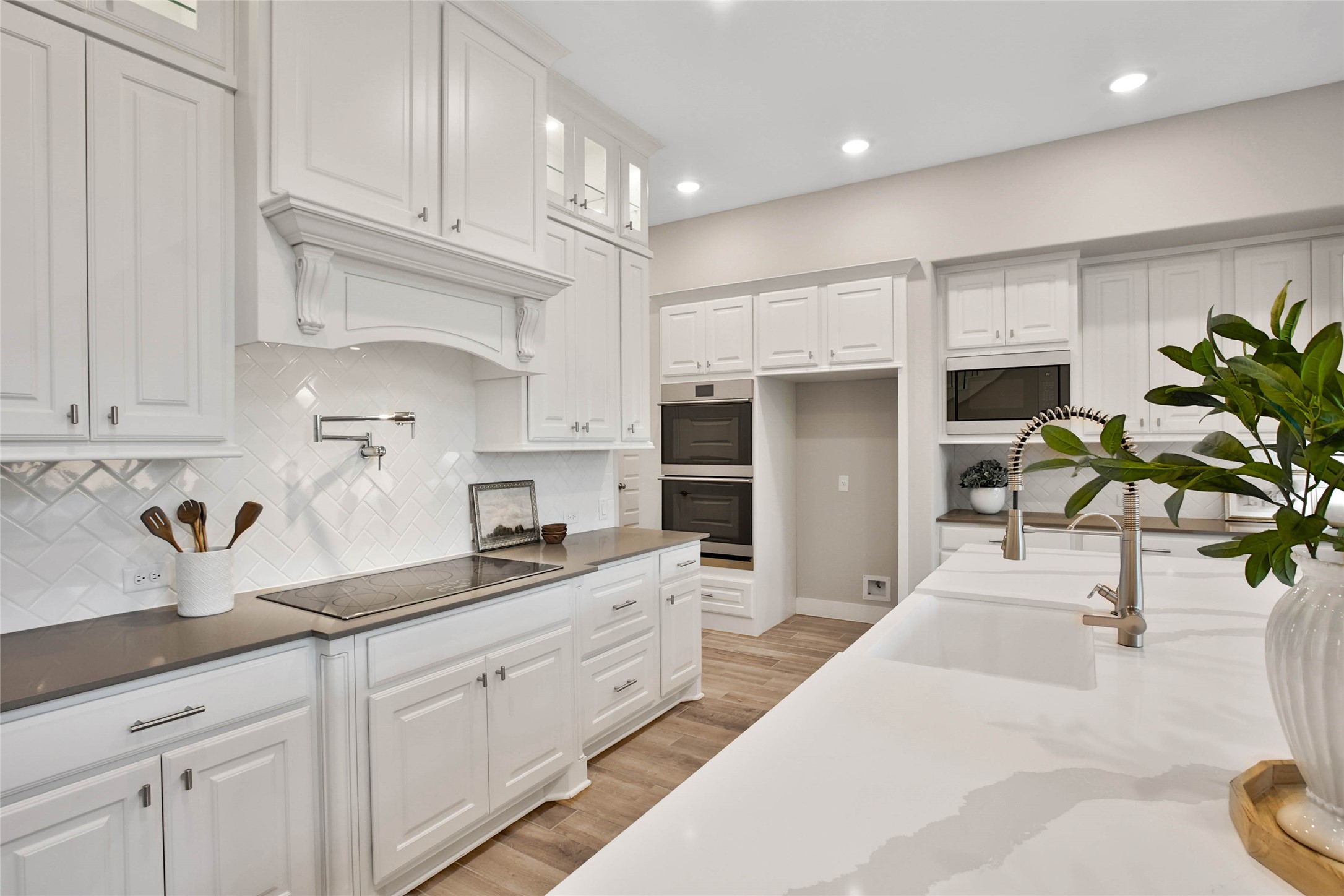 29402 Cir S Rnch Trail Fulshear, TX 77406 - Photo 13 of 50 This gourmet kitchen features a farmhouse sink and top-of-the-line Café stainless steel appliances. Combining high-end style with everyday functionality, it’s a space any home chef will appreciate.