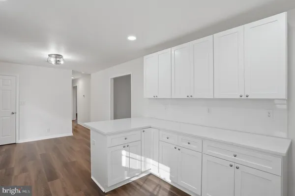 a view of cabinets and wooden floor