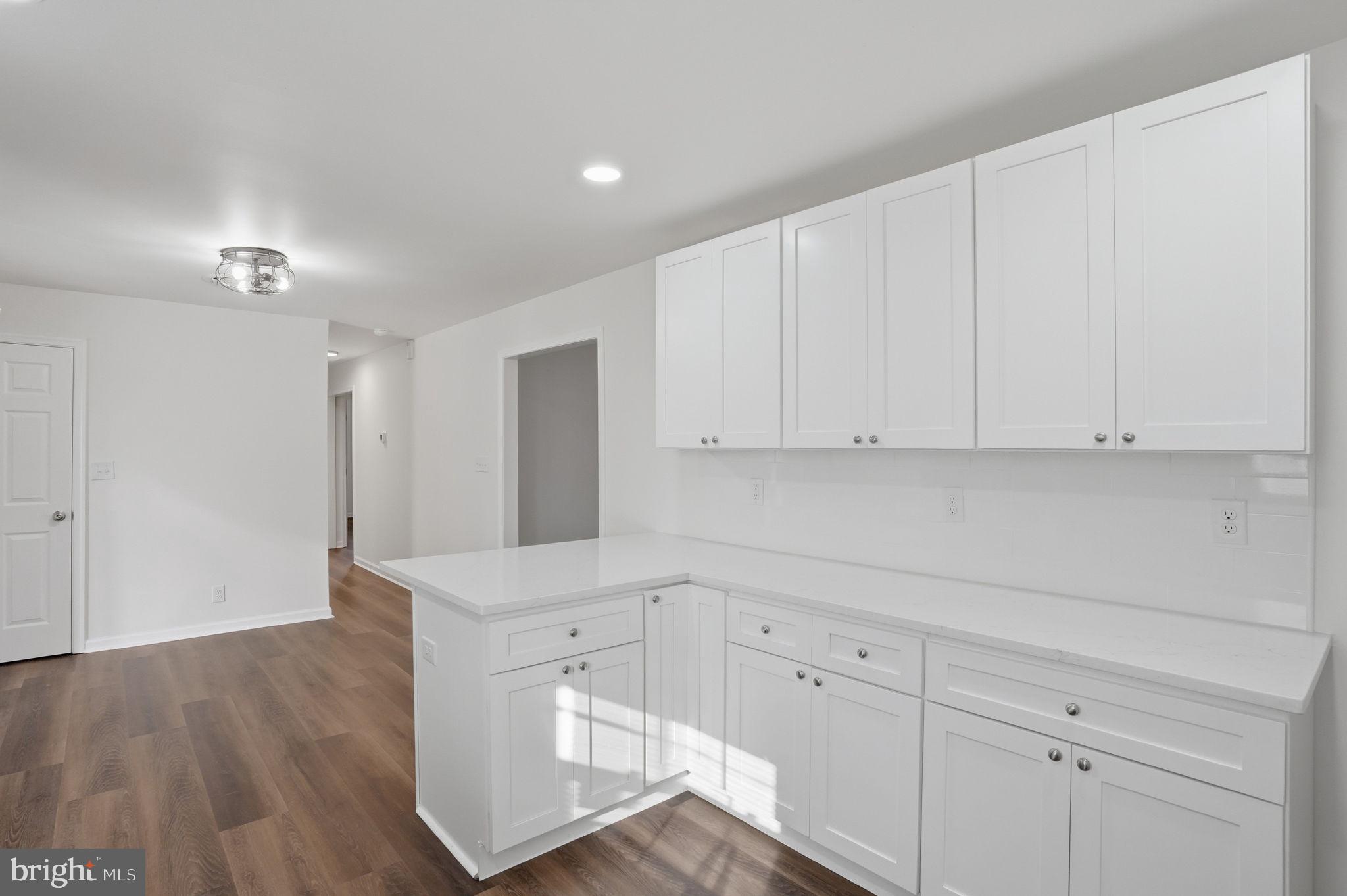 1804 Hourglass Road Hartly, DE 19953 - Photo 12 of 46 a view of cabinets and wooden floor
