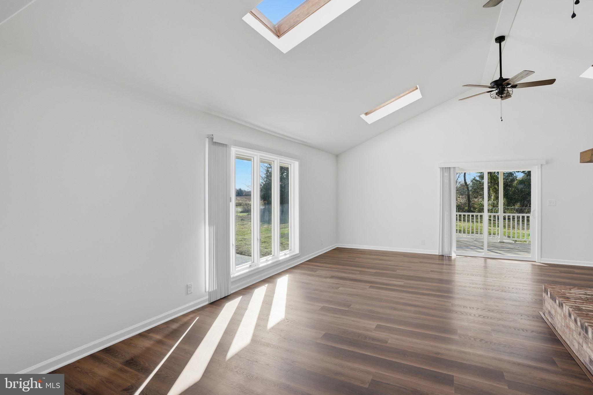 1804 Hourglass Road Hartly, DE 19953 - Photo 22 of 46 wooden floor in an empty room with a window