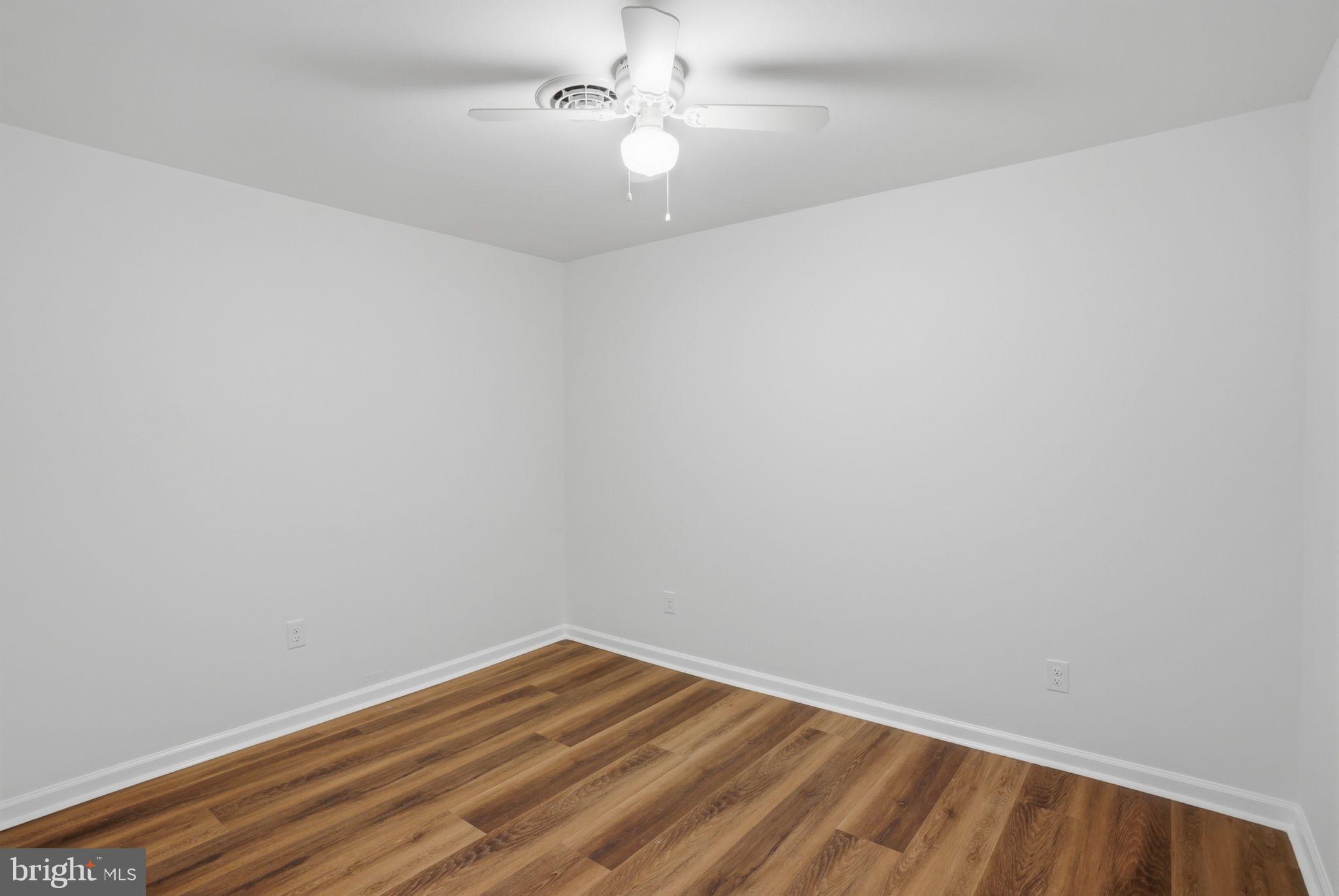 1804 Hourglass Road Hartly, DE 19953 - Photo 33 of 46 a view of an empty room with wooden floor