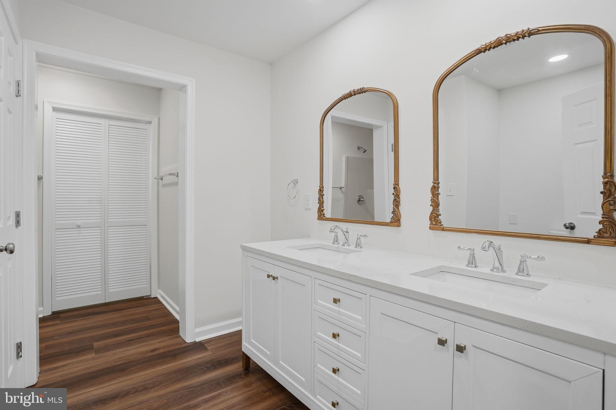 1804 Hourglass Road Hartly, DE 19953 - Photo 36 of 46 a bathroom with a double vanity sink and mirror