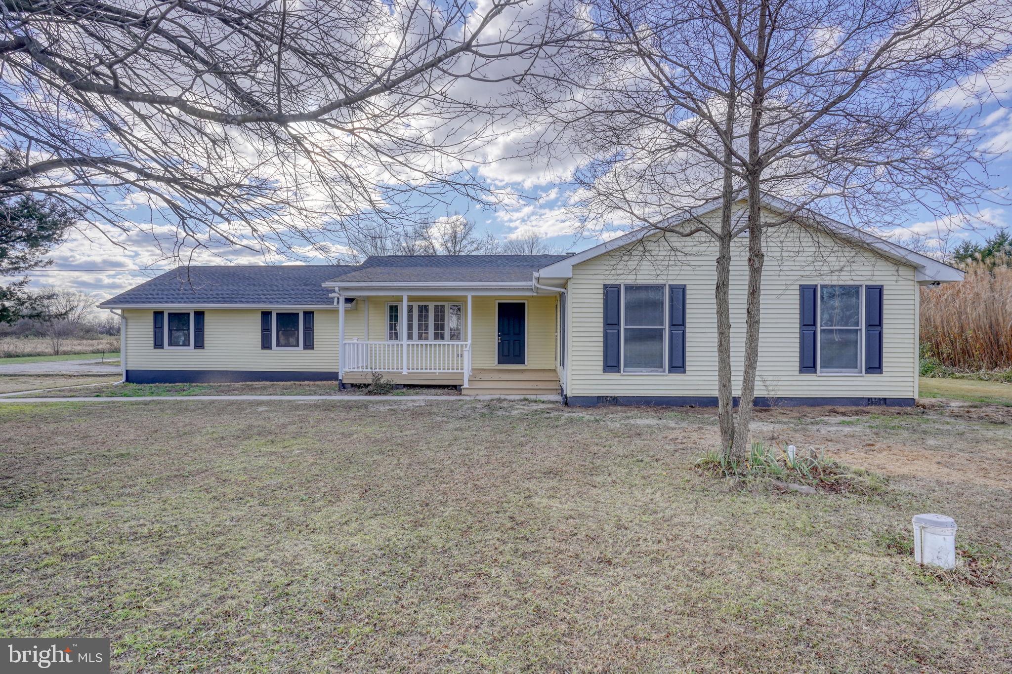 1804 Hourglass Road Hartly, DE 19953 - Photo 4 of 46 front view of a house with a dry yard