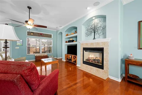 a living room with furniture a window and a fireplace