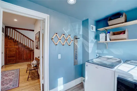 a view of a hallway with washer and dryer