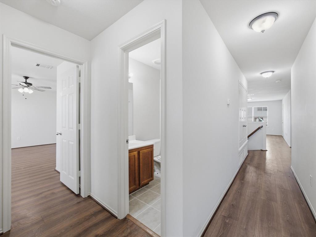 2021 Laughlin Road Fort Worth, TX 76177 - Photo 27 of 40 a view of a hallway with wooden floor and staircase
