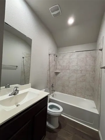a bathroom with a sink a toilet and a bathtub
