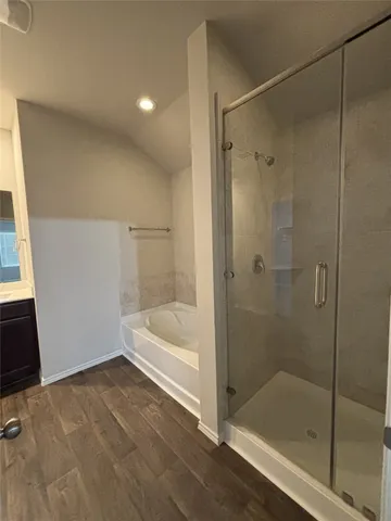 a bathroom with a bathtub and a shower