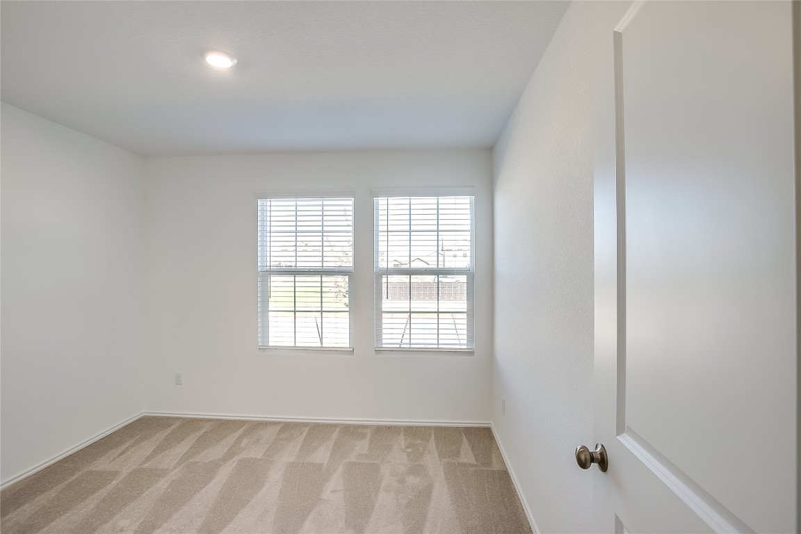 1133 Largemouth Road Bastrop, TX 78602 - Photo 14 of 16 a view of an empty room with a window