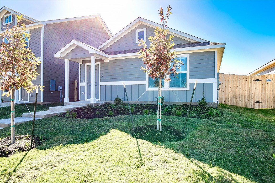 1133 Largemouth Road Bastrop, TX 78602 - Photo 2 of 16 a front view of a house with garden
