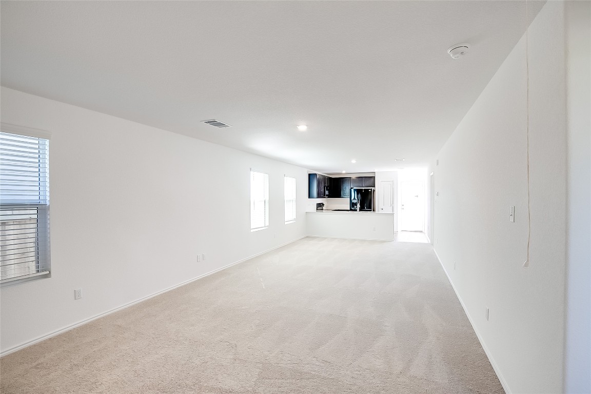 1133 Largemouth Road Bastrop, TX 78602 - Photo 6 of 16 a big room with closet and windows