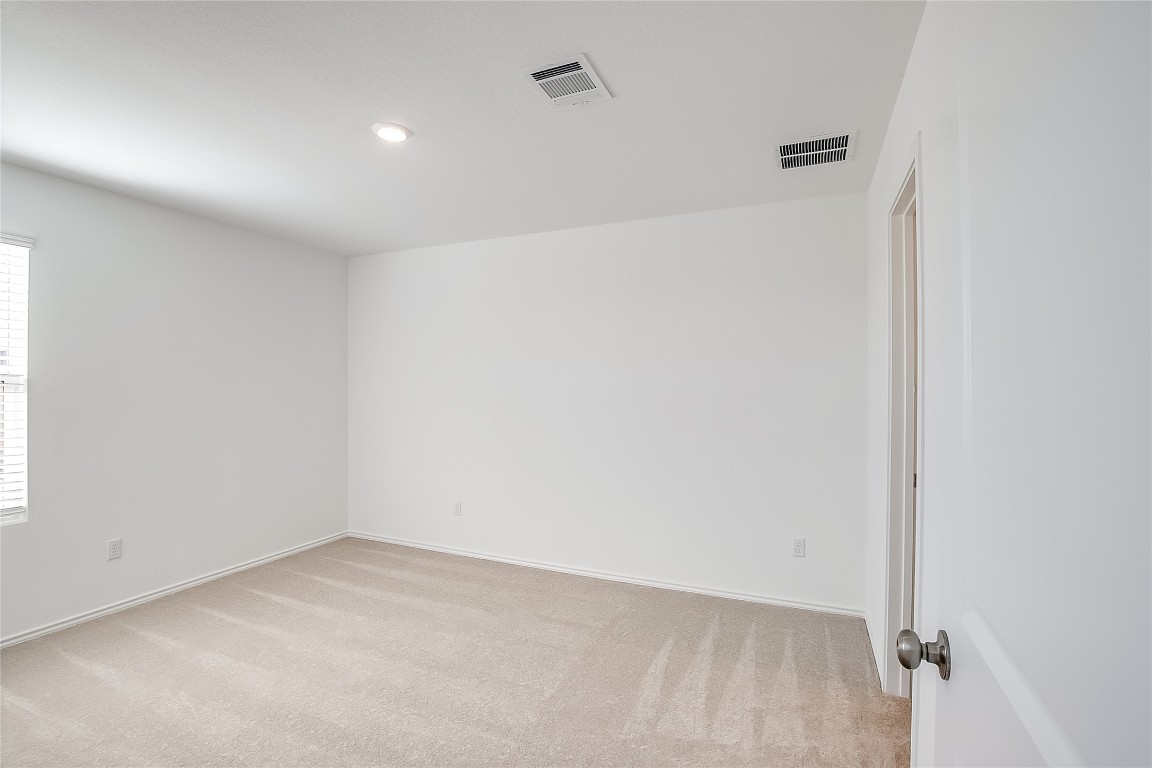 1133 Largemouth Road Bastrop, TX 78602 - Photo 9 of 16 an empty room with a workbench