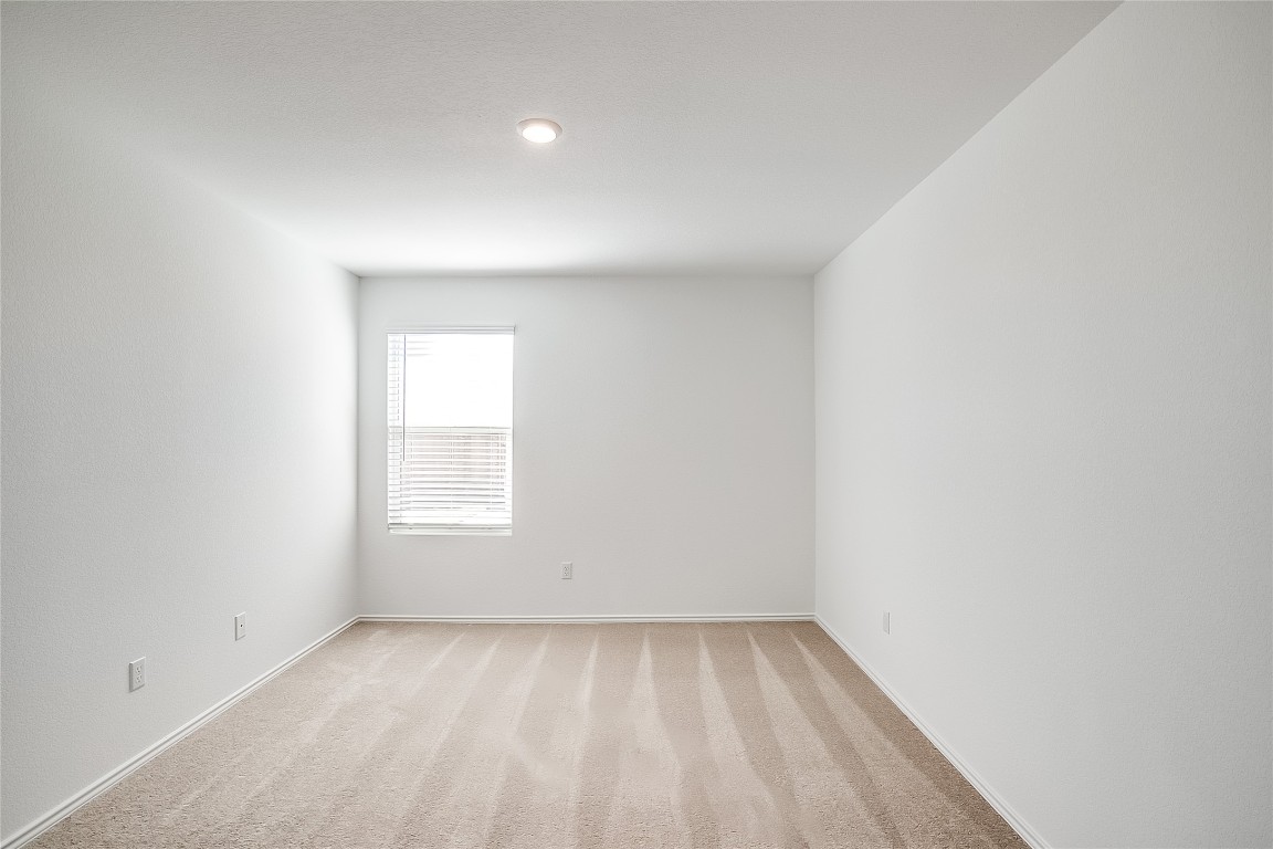 1133 Largemouth Road Bastrop, TX 78602 - Photo 10 of 16 an empty room with a window