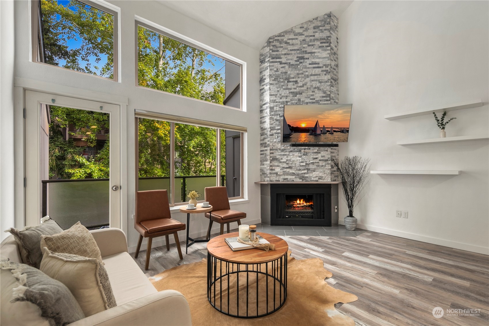 7307 Sand Point Way Northeast, Unit B618 Seattle, WA 98115 - Photo 13 of 23 a living room with furniture a fireplace and a large window