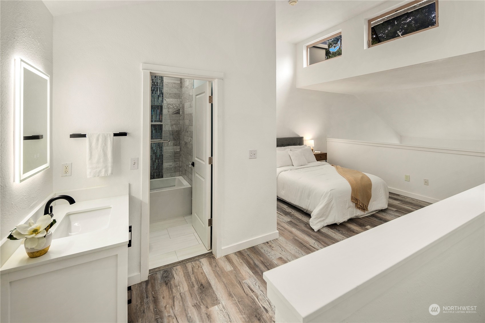 7307 Sand Point Way Northeast, Unit B618 Seattle, WA 98115 - Photo 15 of 23 a bathroom with a tub sink and mirror