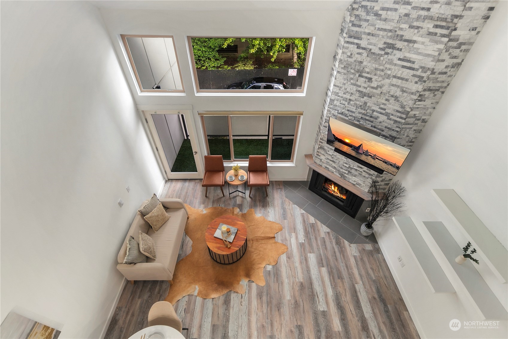 7307 Sand Point Way Northeast, Unit B618 Seattle, WA 98115 - Photo 18 of 23 a living room with furniture and a fireplace