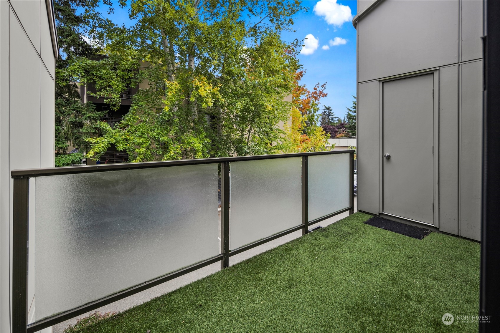 7307 Sand Point Way Northeast, Unit B618 Seattle, WA 98115 - Photo 23 of 23 an empty room with wooden floor and plant
