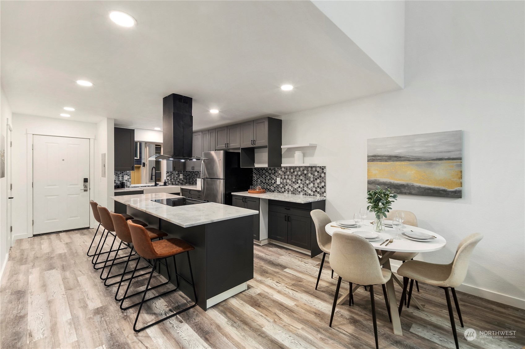 7307 Sand Point Way Northeast, Unit B618 Seattle, WA 98115 - Photo 3 of 23 a kitchen with a table and chairs in it