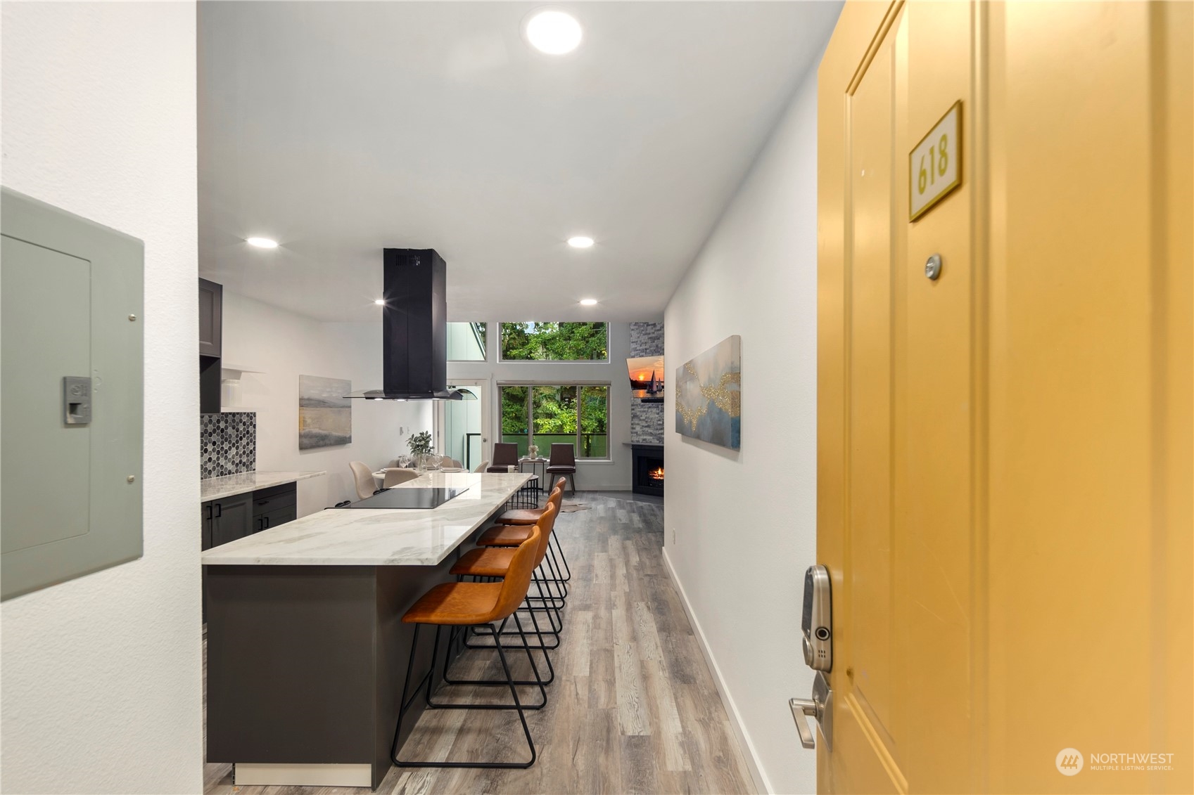 7307 Sand Point Way Northeast, Unit B618 Seattle, WA 98115 - Photo 4 of 23 a dining room with wooden floor a sink and a refrigerator