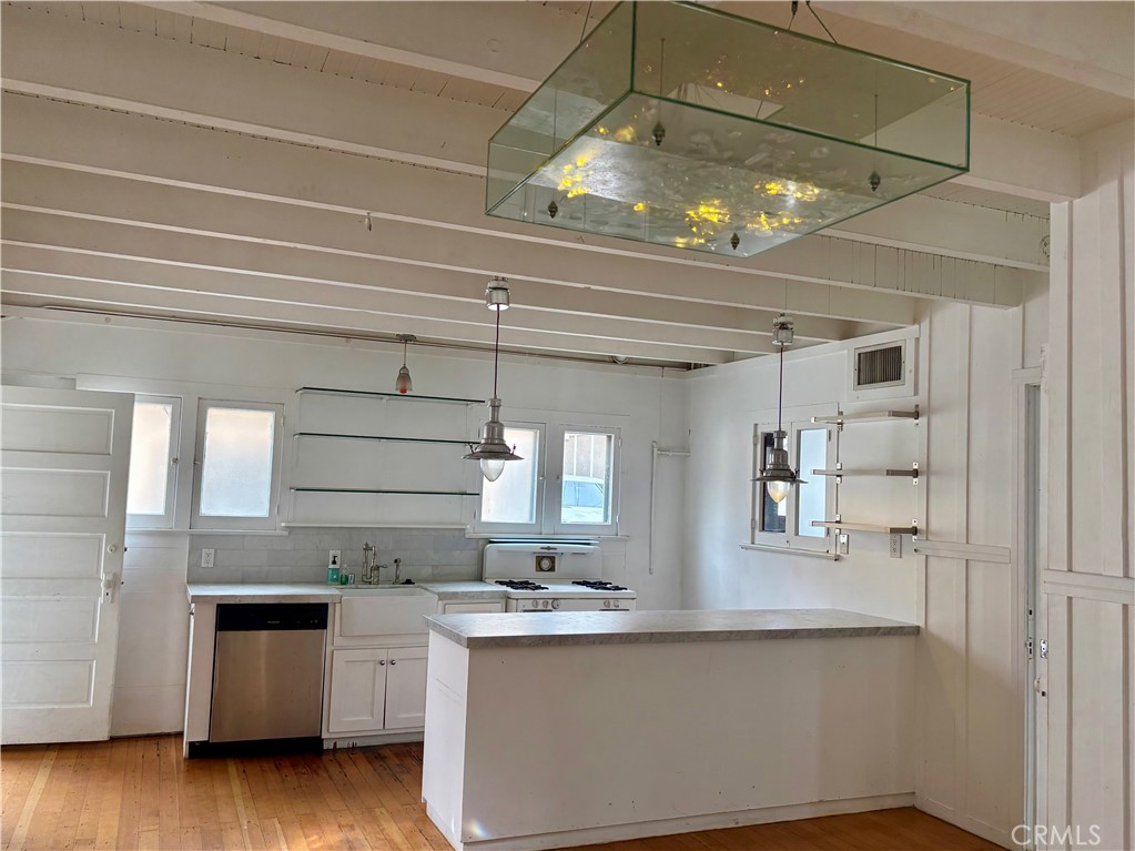 25 Galleon Street Marina del Rey, CA 90292 - Photo 11 of 41 a kitchen with stainless steel appliances granite countertop a sink and cabinets