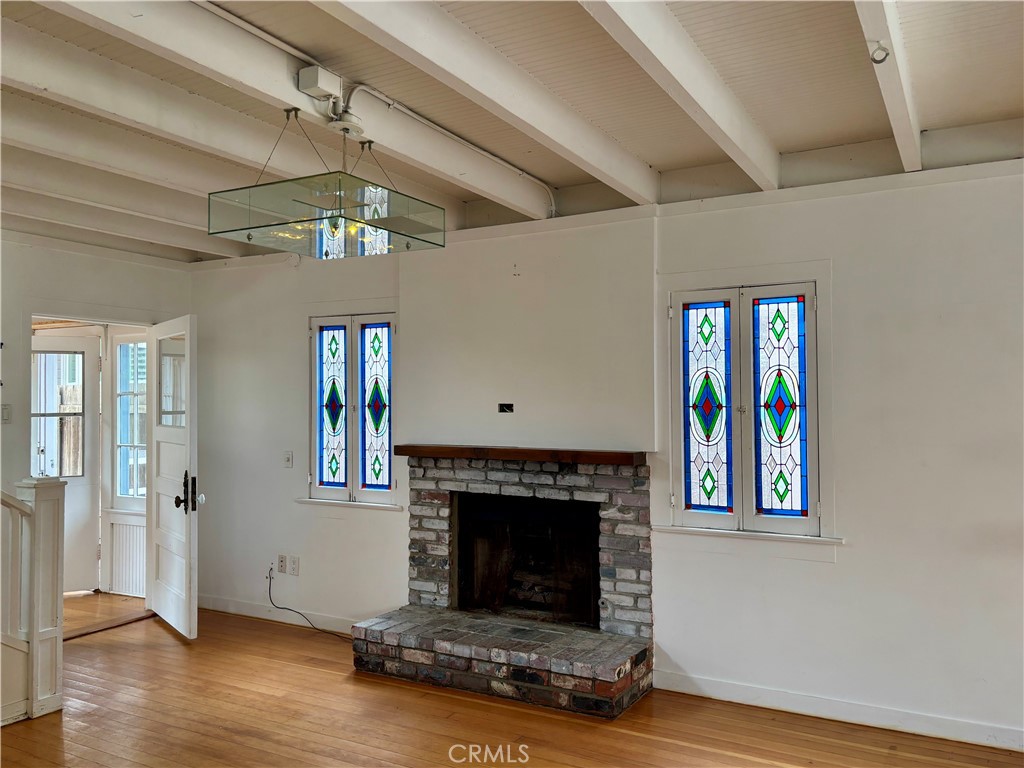 25 Galleon Street Marina del Rey, CA 90292 - Photo 10 of 41 a living room with a fireplace windows and a ceiling fan