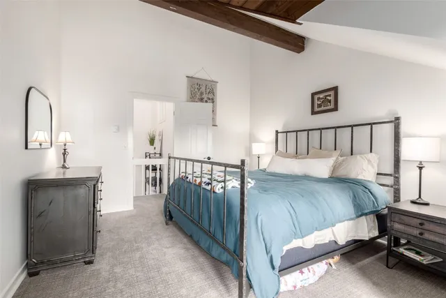 a bathroom with a granite countertop sink toilet a large mirror a vanity and shower