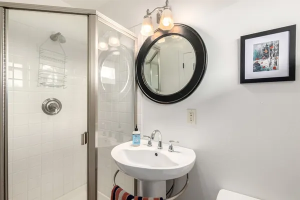 a bedroom with a bed and a painting