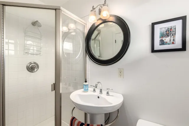 a bedroom with a bed and a painting